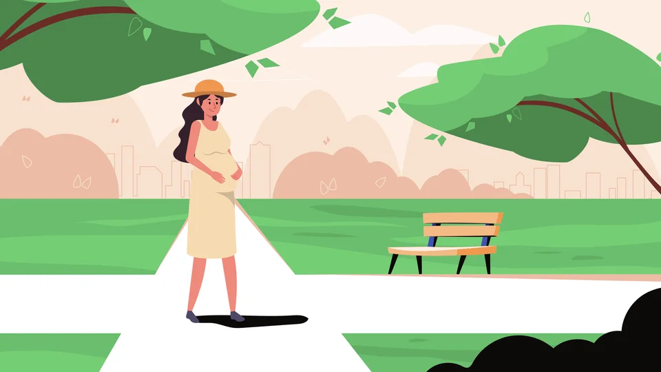 Pregnant woman walking through a green Mediterranean city park